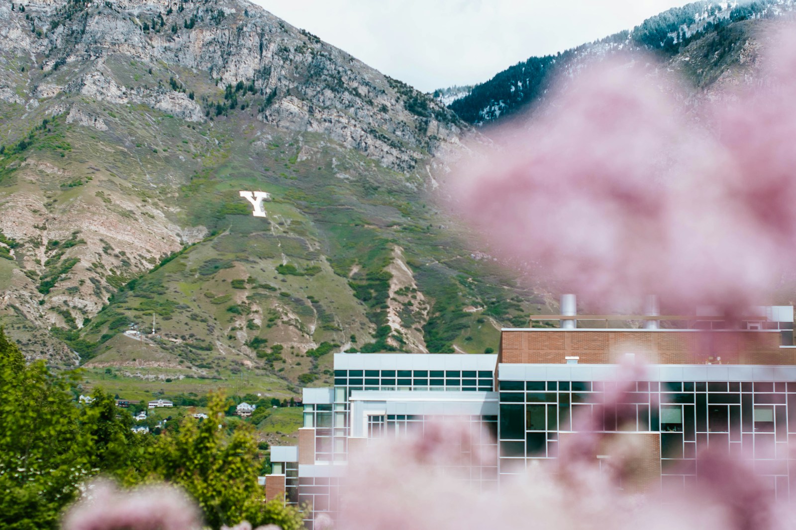 Y Mountain rising behind the Life Sciences Building on the BYU campus in Provo, Utah County