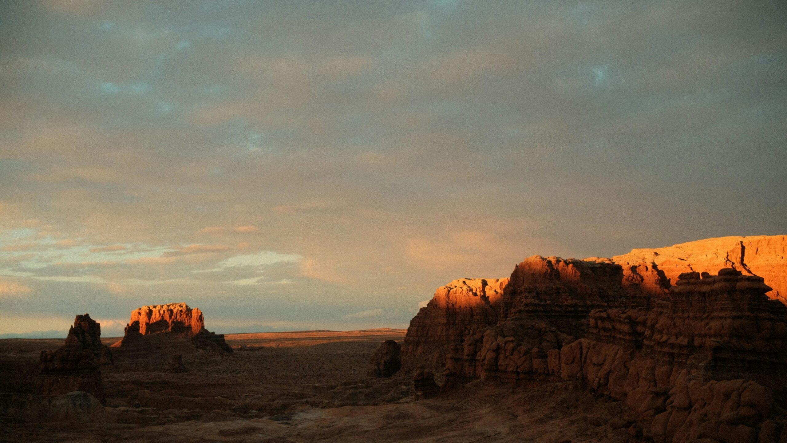 Goblin Valley State Park sandstone hoodoos glowing in the Utah desert at golden hour