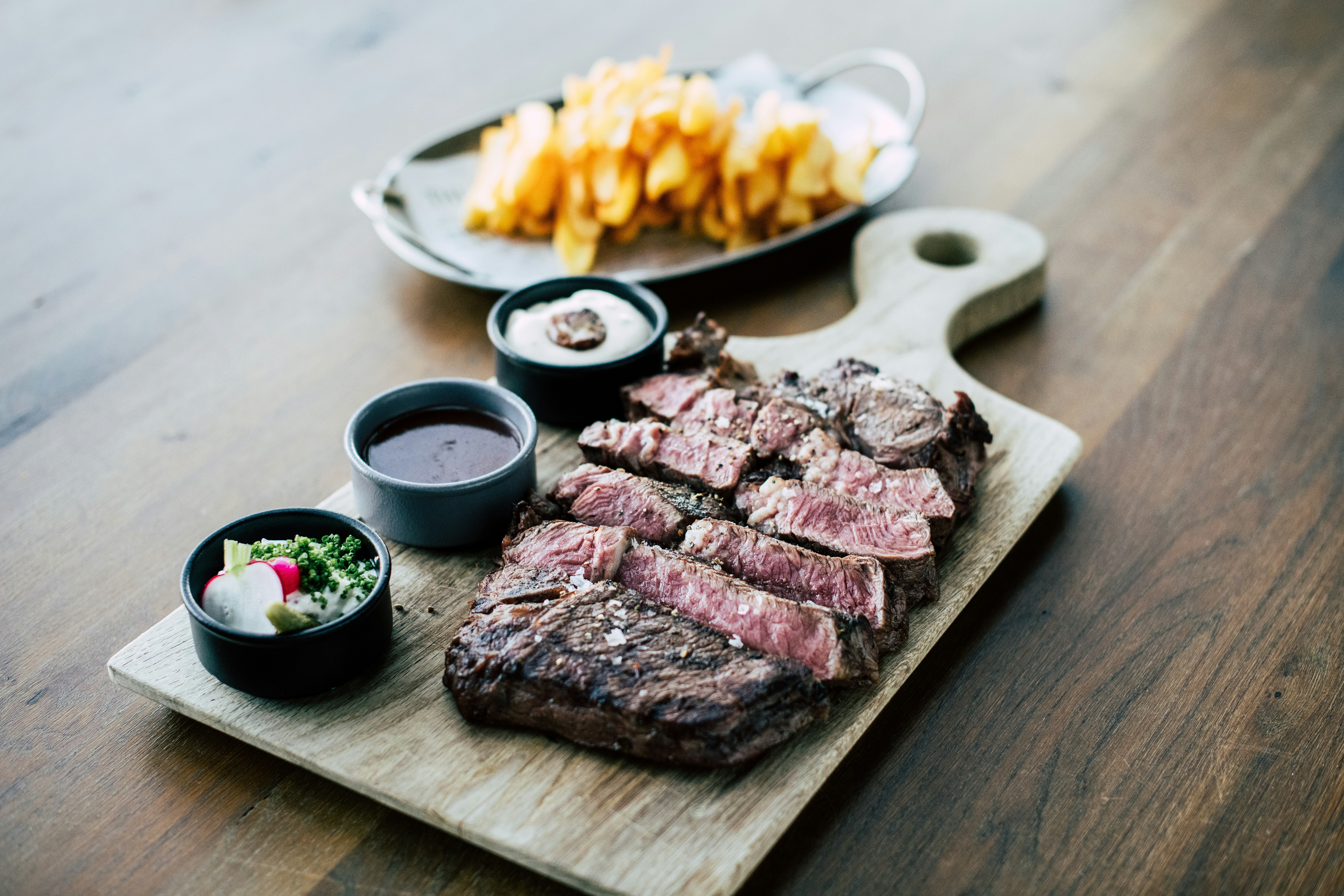 Grilled steak plate served with chips, representative of the American ranch-town food scene in downtown Kanab