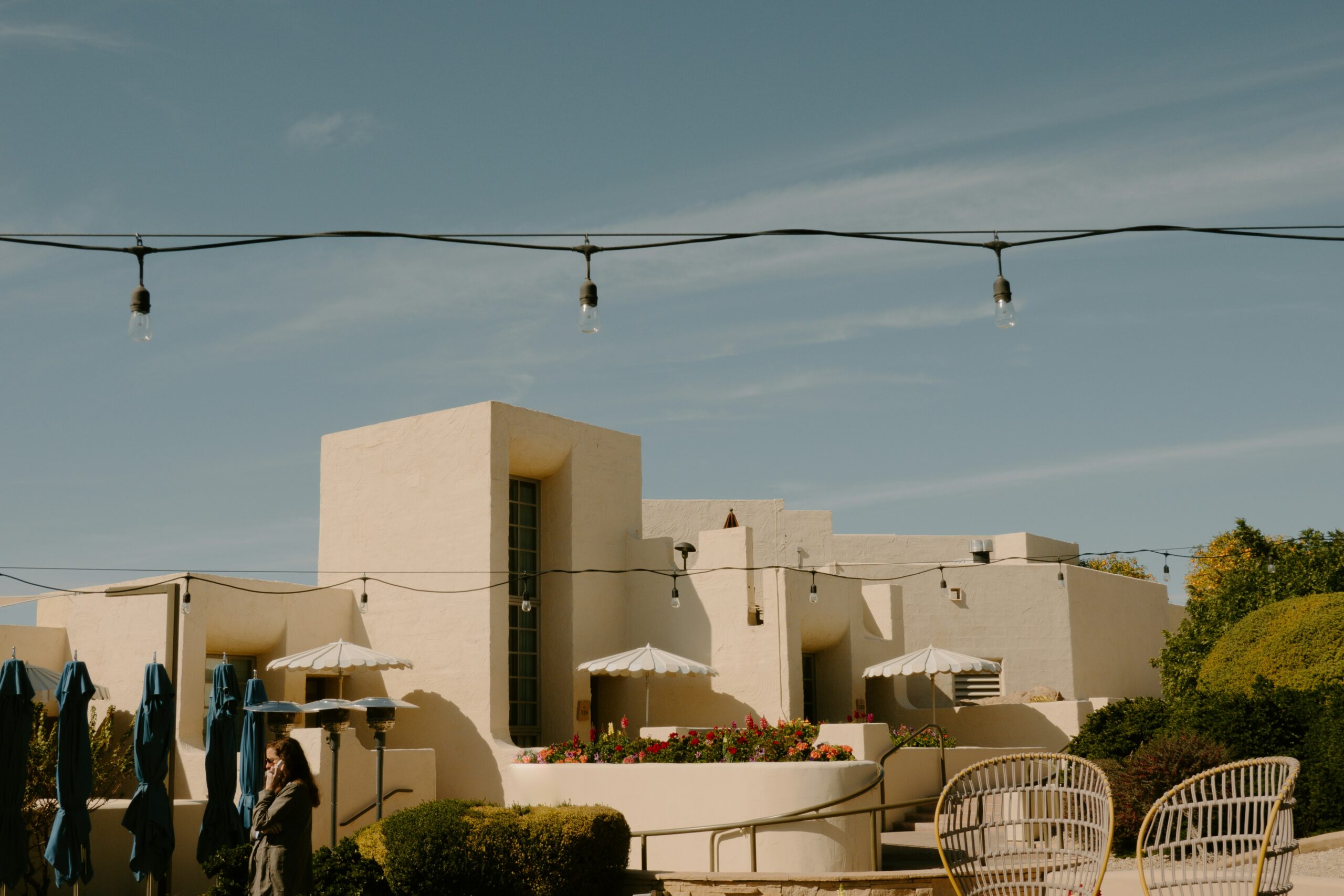 Cream-colored boutique desert hotel exterior with string lights and outdoor seating, typical Southwest lodging near Kanab