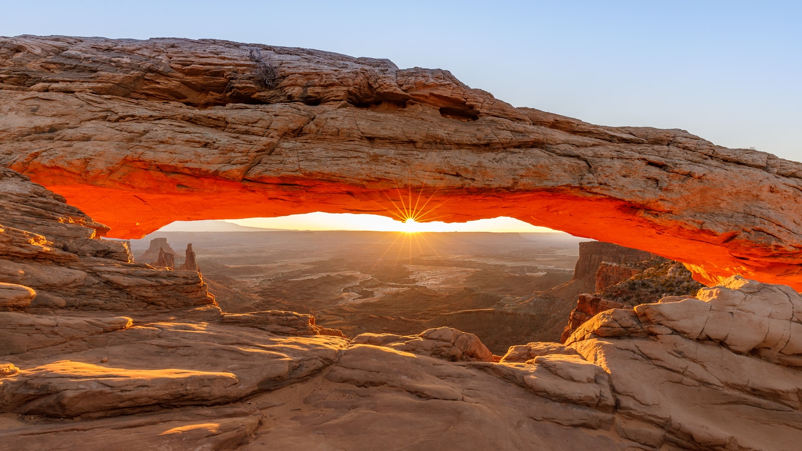 Sunrise lighting Mesa Arch in Canyonlands' Island in the Sky near Moab, Utah