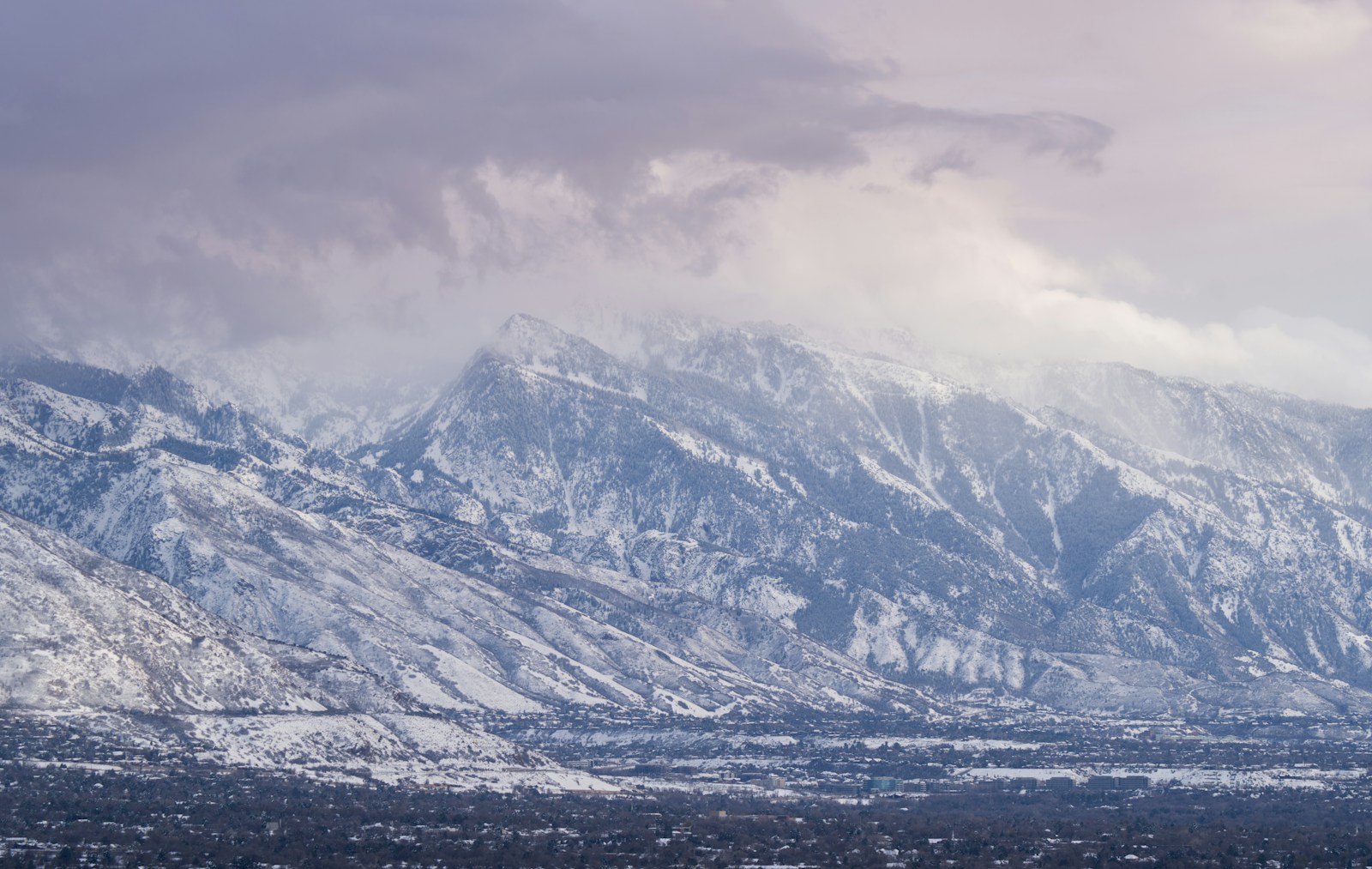 Snow-covered Wasatch Mountains rising above Utah County on the eastern shore of Utah Lake