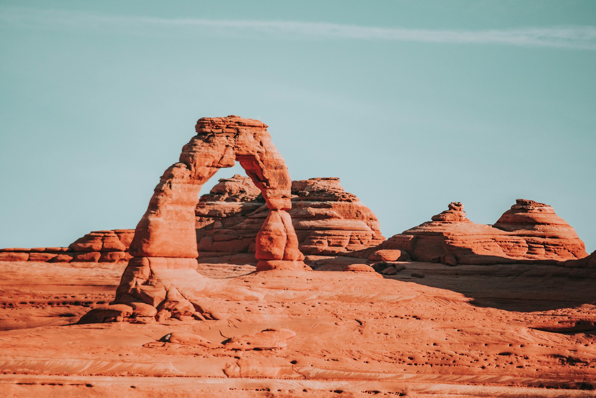 Red sandstone formations in Arches National Park bathed in warm afternoon light