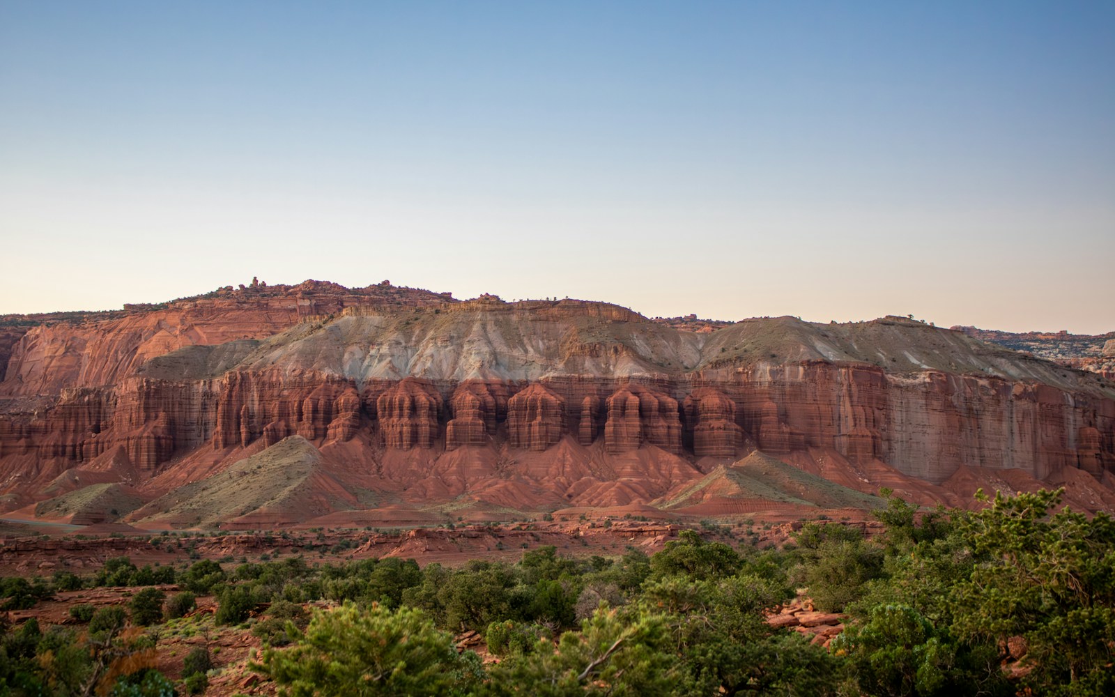 Layered red and gray sandstone cliffs of the Waterpocket Fold monocline in Capitol Reef National Park