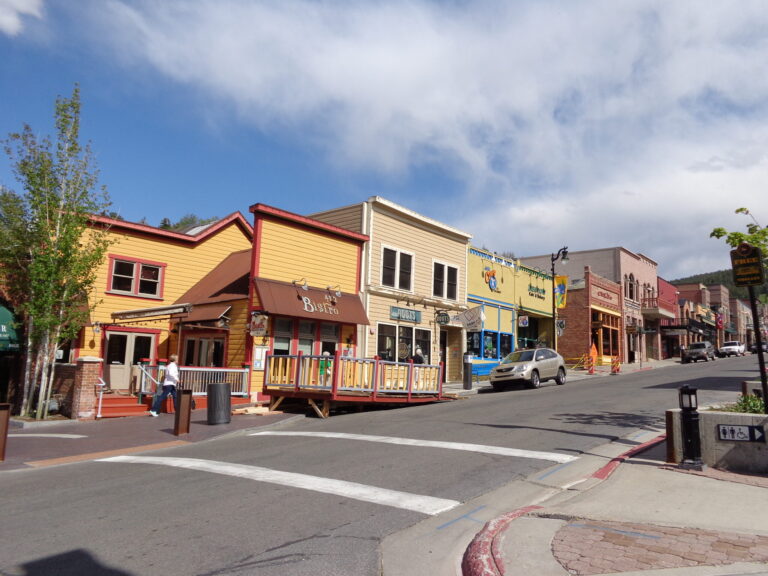 Historic Main Street in Park City, Utah — brick storefronts and Wasatch mountain backdrop
