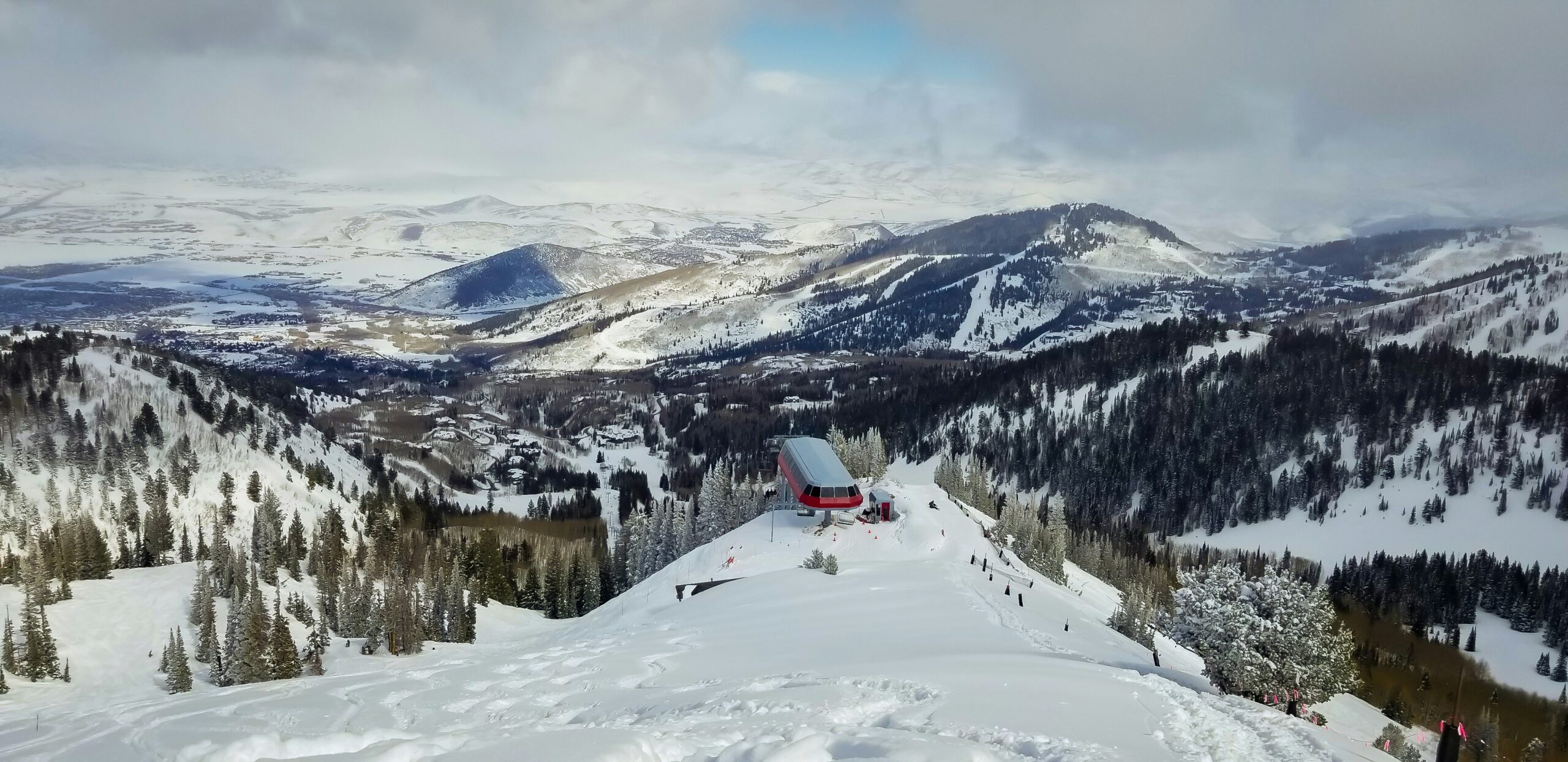 Snowy view down the Ninety-Nine 90 lift at 9,990 feet on Park City Mountain, Utah